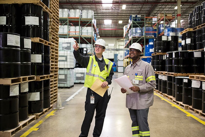 Two employees in a warehouse